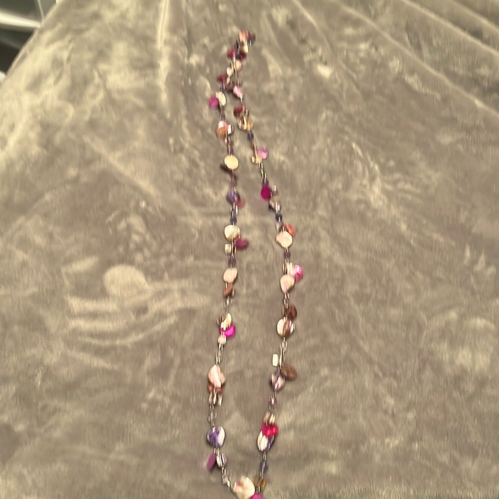 Fun necklace in pinks and purples.   Mix of stones and metal. About 24 inch long